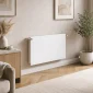 Kartell K-Flat white type 11 plain flat panel radiator 600mm high x 1000mm wide shown mounted on a living room wall